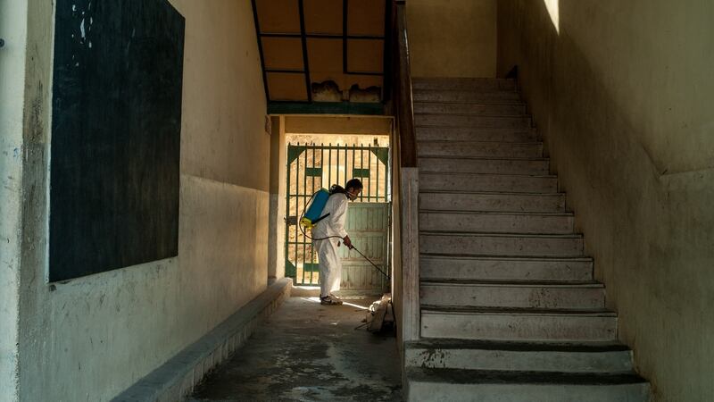Workers from ministry of health  disinfect a public school in Antananarivo, Madagascar. Photograph: Henitsoa Rafalia/Anadolu Agency/Getty Images