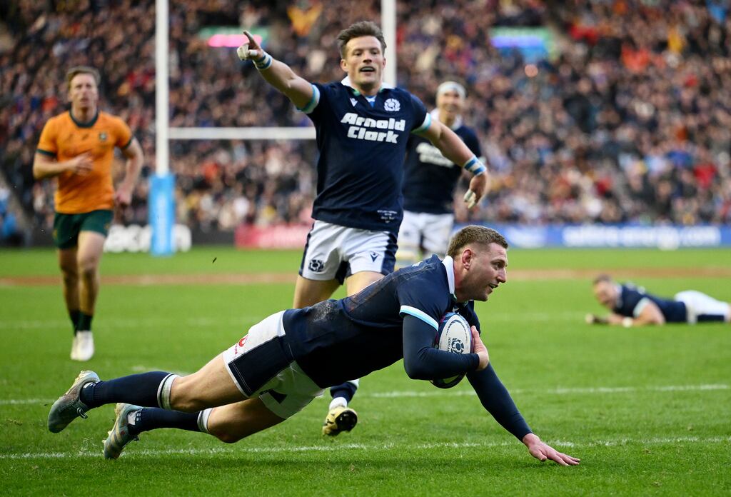 Finn Russell of Scotland dives in to score his team's fourth try. Photograph: Stu Forster/Getty