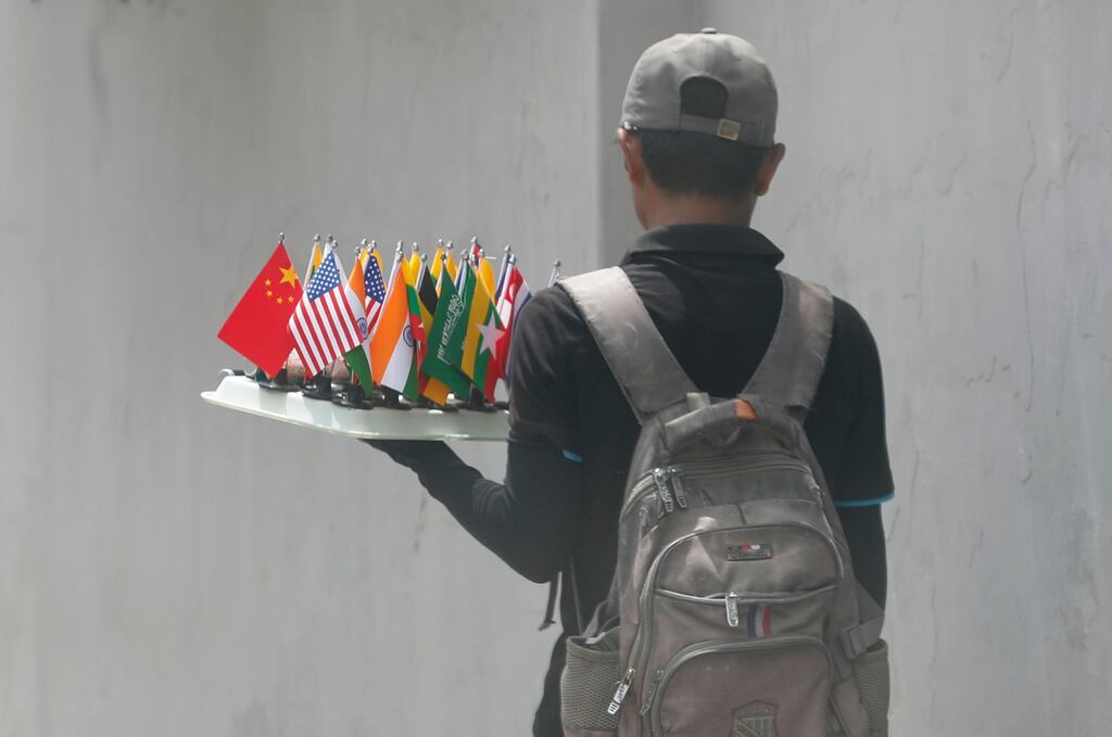 A man sells US and other national flags in Yangon, Myanmar. Photograph: Nyein Chan Naing/EPA