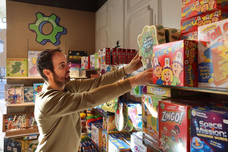 Conor Brady working in Cogs Toys and Games in Dublin. Photograph: Dara Mac Dónaill