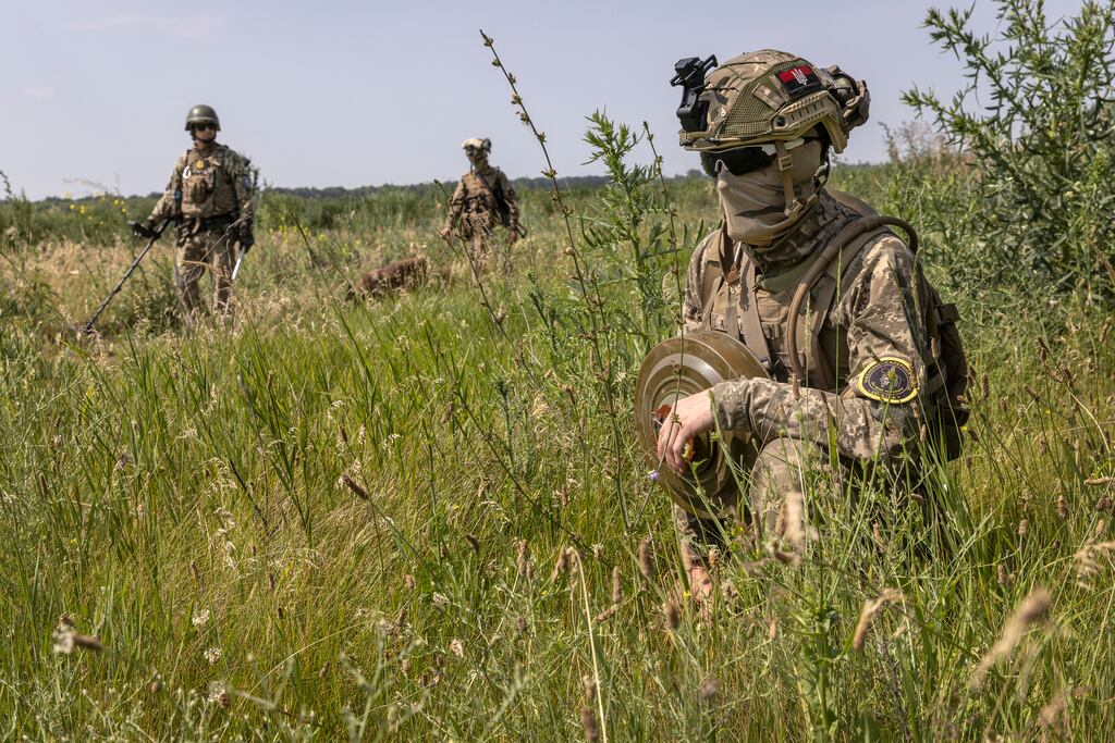 Ukrainian soldiers from the 102nd Territorial Defense Brigade’s mine detonation unit carry inactive anti-tank mines during training exercises near the city of Huliaipole, in the Zaporizhzhia region on June 24th. Photograph: David Guttenfelder/The New York Times
