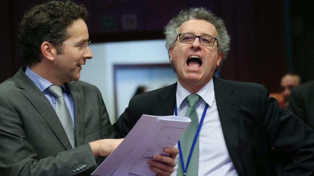 Jeroen Dijsselbloem (left), eurogroup president , and Luxembourg’s minister for finance Pierre Gramegna in Brussels yesterday. Photograph: EPA