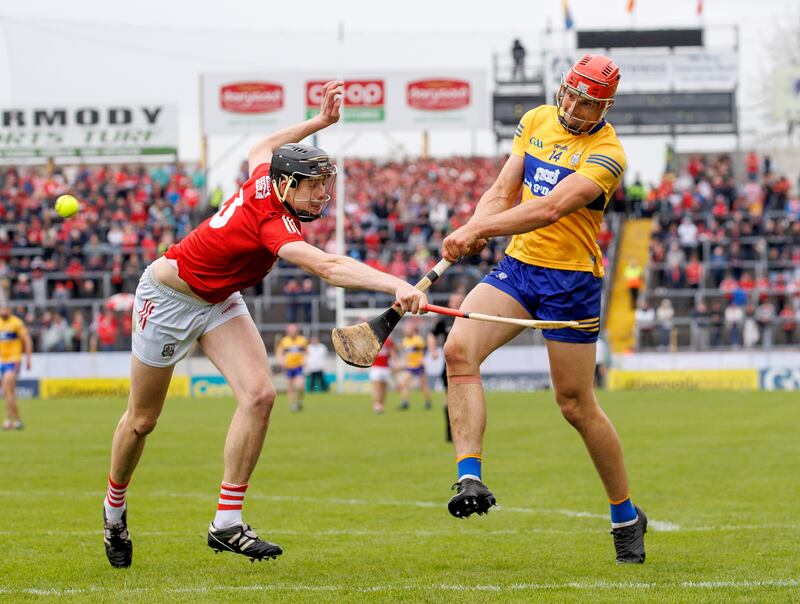 Cork’s Robert Downey and Peter Duggan of Clare in action during the championship clash at Semple Stadium. Cork forfeited home advantage for the game, which Clare won. Photograph: James Crombie/Inpho