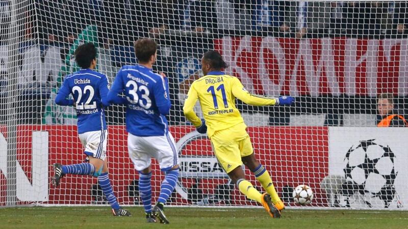 Chelsea’s Didier Drogba (right) scores a against Schalke 04 during their Champions League group G match in Gelsenkirchen. Photograph: Wolfgang Rattay / Reuters