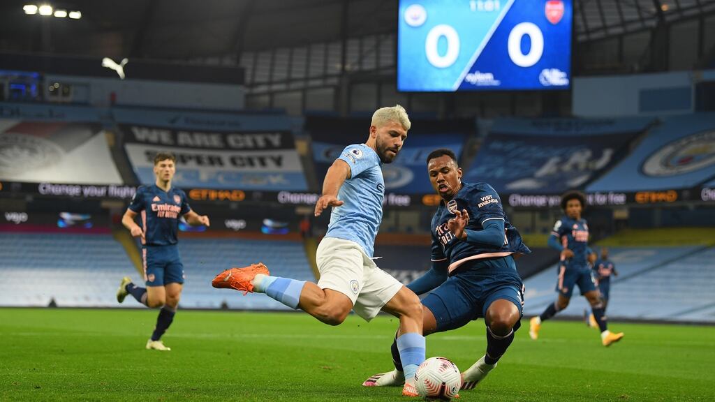 Sergio Agüero of Manchester City attempts to shoot under pressure from Gabriel of Arsenal during the Premier League match at the Etihad Stadium. Photo: Michael Regan/Getty Images