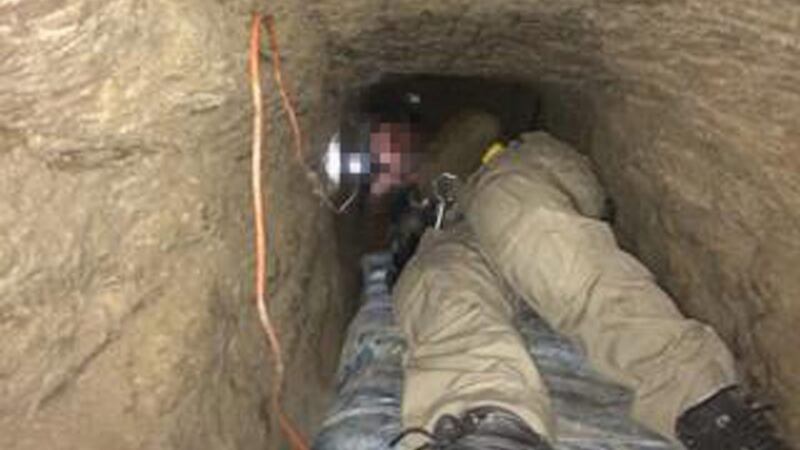 An undated handout picture made available by the US attorney’s office for the southern district of California on 21 April 2016 shows the narrow passageway of what is believed to be the longest cross-border tunnel discovered along the California-Mexico border, USA. Photograph: EPA/US attorney’s office.