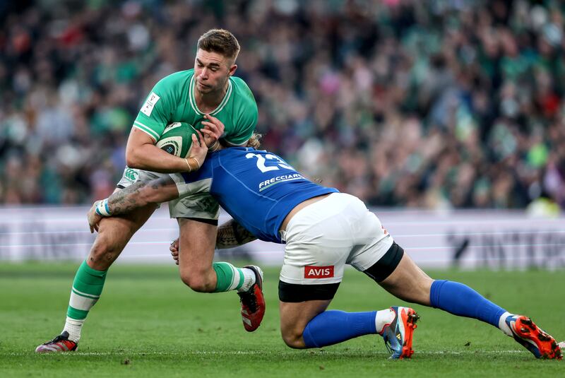 Ireland’s Jack Crowley takes a tackle by Frederico Mori of Italy/ Photograph: Dan Sheridan/Inpho