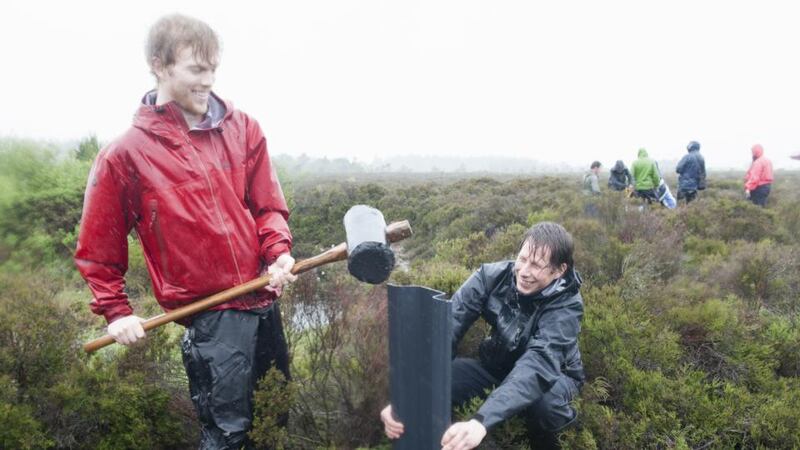 Rewet wet wet: Christian Caille and Christian Volkmann dam a drain on Girley Bog. Photograph: Dora Kazmierak