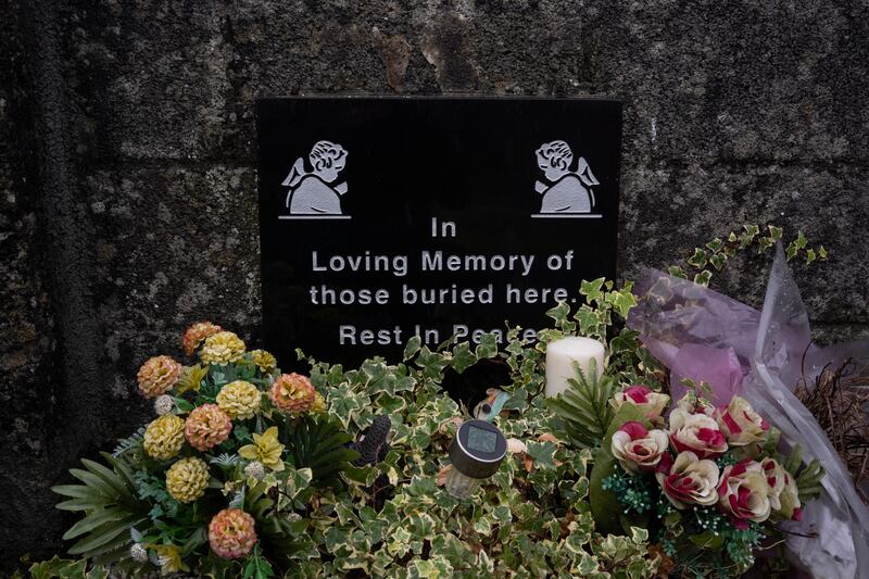 A plaque to the babies buried, many in a disused sewer system. Photograph: Paulo Nunes dos Santos/New York Times