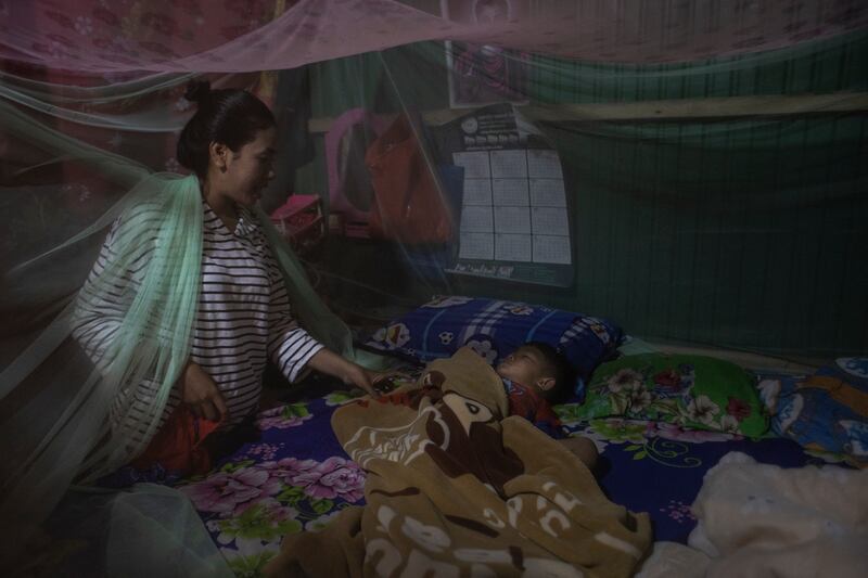 Ry Ly with the little boy she birthed as a surrogate and is now rearing. Photograph: Nadia Shira Cohen/The New York Times