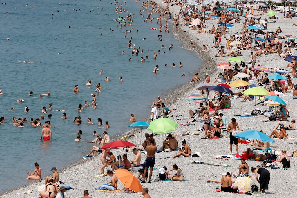 People visit a beach in Nice, southern France, in June 2025. Temperatures reached up to 38 degrees Celsius in Nice. Photograph: Sebastien Nogier/ EPA