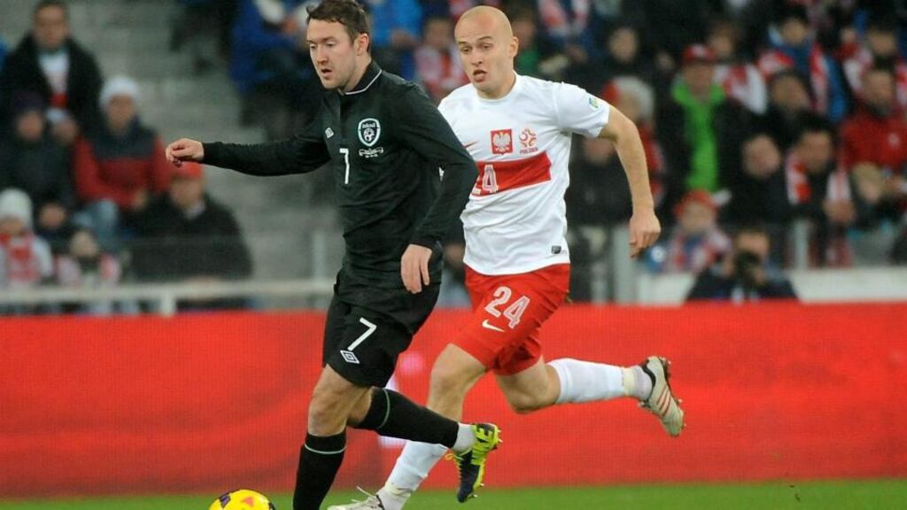 Aiden McGeady of Ireland holds off the challenge of Poland’s Michal Pazdan. Denis Irwin though the winger was Irelland’s only bright spark on the evening