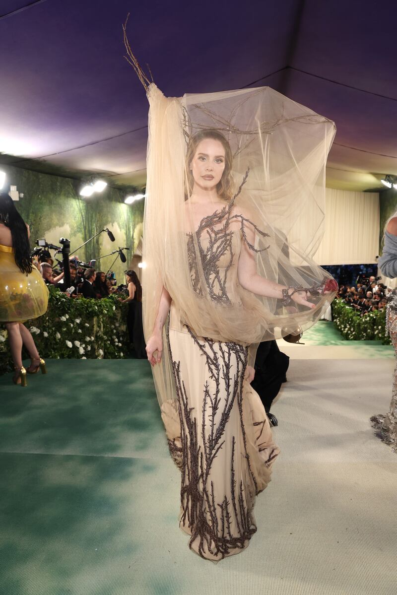 Singer Lana Del Rey wore a mother nature-inspired beige tulle and root embroidery design by Sean McGirr, the newly minted Irish creative director for Alexander McQueen. Photograph: Kevin Mazur/MG24/Getty Images