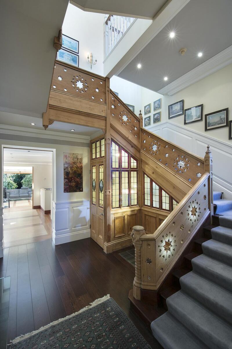 A 24ft central atrium is the fulcrum of the house and a stripped-back pitch pine staircase with circular star-carved motifs forms the centrepiece.