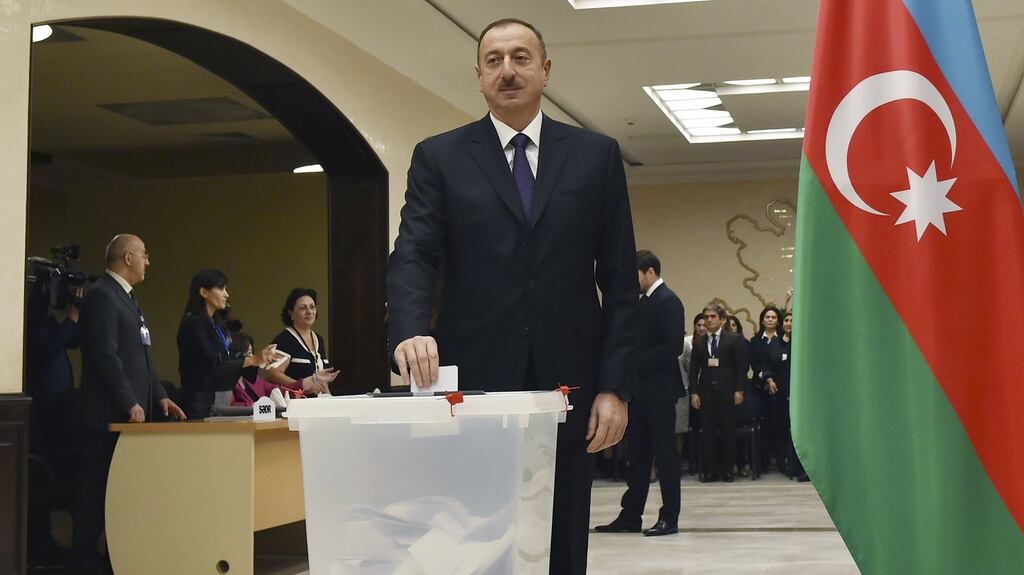 Azerbaijan’s president Ilham Aliyev casts his ballot at a polling station during the parliamentary election in Baku, Azerbaijan on Sunday. Photograph: Reuters/Vugar Amrullayev/Pool