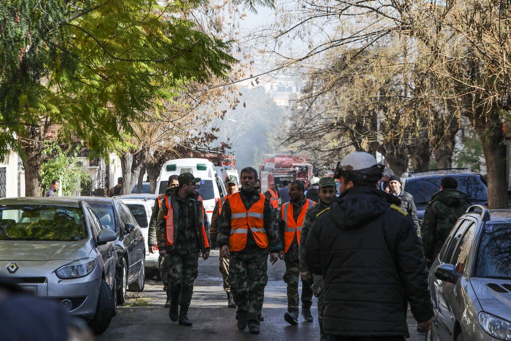 Rescuers and security forces gather at the scene of an Israeli strike in Damascus. Iran's president Ebrahim Raisi has vowed to respond to 'the crimes of the Zionist regime'. Photograph: Louai Beshara/AFP via Getty Images