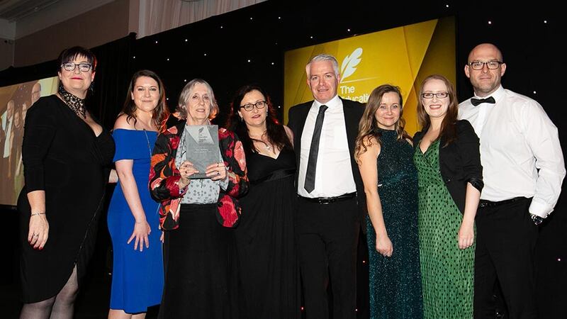 Dr Shelagh Waddington, Emeritus Lecturer, Geography Department, Maynooth University presents the Best Marketing / Communications Team award to the National College of Ireland Team
