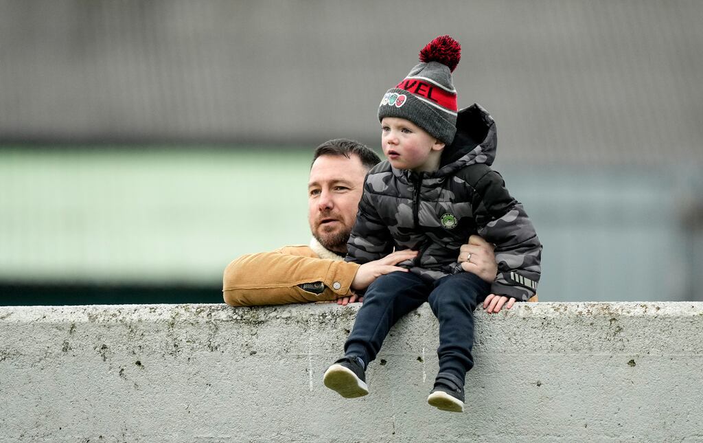 Young Offaly fan Senan McConigley watches on with his father Michael during the Allianz Hurling League Division 1A match against Waterford at Glenisk O'Connor Park in Tullamore. Photograph: James Lawlor/Inpho