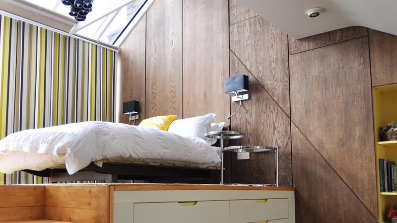 If your ceilings are high, install a platform bed so you can use the space below as storage.