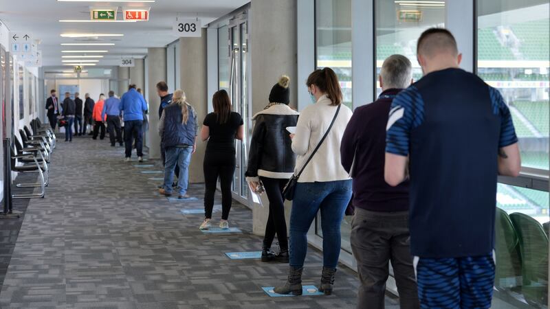 People queue in the Aviva Stadium for their first dose of the Covid-19 vaccine over the Easter bank holiday weekend. Photograph: Alan Betson