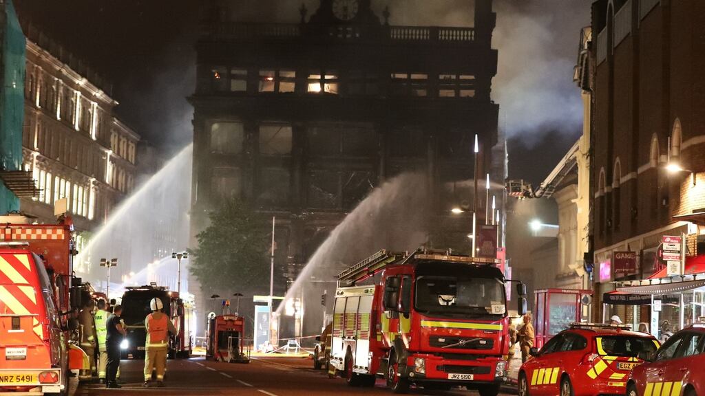 Firefighters at the Primark store in Belfast city centre, where a major blaze broke out on Tuesday. Photograph: Liam McBurney/PA Wire