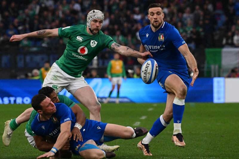 Ireland's Mack Hansen and Italy's Edoardo Padovani fight for the ball. Photograph: Vincenzo Pinto/AFP via Getty Images