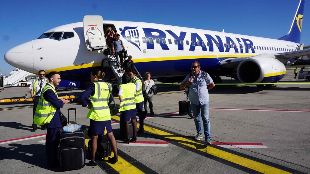Ryanair crew waits as passengers disembark at Brussels South Charleroi Airport: If the UK crashed out of the EU without a deal, it would fall out of Open Skies. Photograph: Emmanuel Dunand/AFP