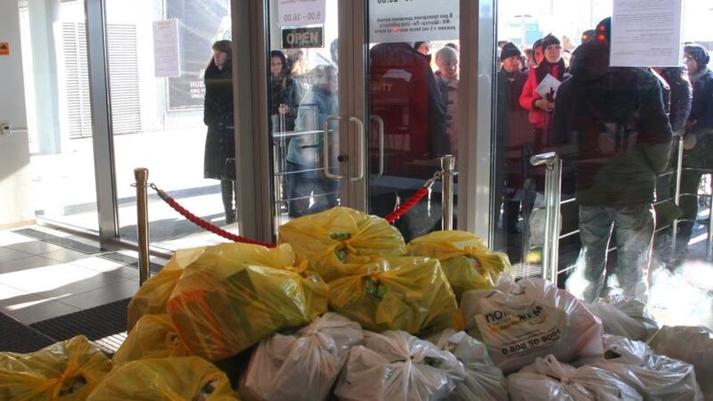 Volunteers distribute humanitarian aid to local people, organized by Ukrainian oligarch Rinat Akhmetov, in Donetsk yesterday. Photograph: Photomig/EPA