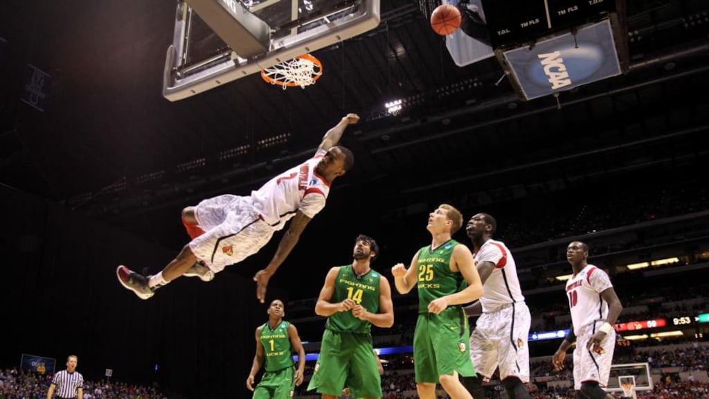 Louisville’s Russ Smith (right) falls to the court after he missed a dunk attempt in the second half against the Oregon Ducks. Photograph: Streeter Lecka/Getty Images