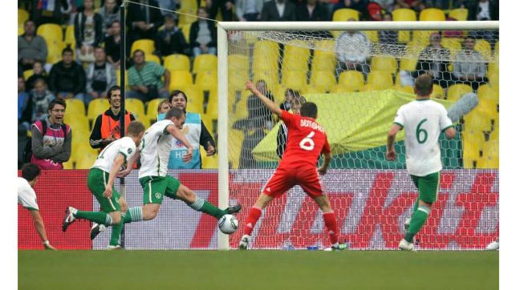 Richard Dunne makes a decisive intervention, stopping a certain Russian goal at the Luzhniki Stadium. - (Photograph: Donall Farmer/Inpho)