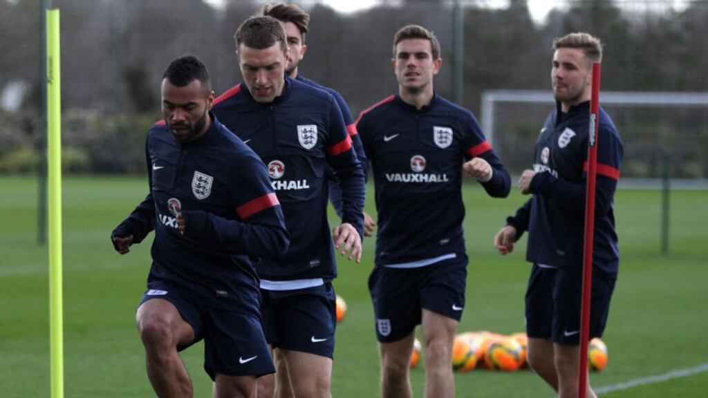 England’s Ashley Cole leads players during training including new player Luke Shaw (rear) for tonight’s friendly against Denmark at Wembley.