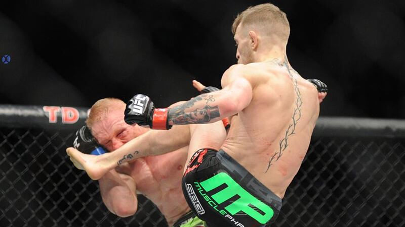 Ireland’s Conor McGregor lands a kick on Germany’s Denis Siver in Boston. Photograph: Emily Harney / Inpho
