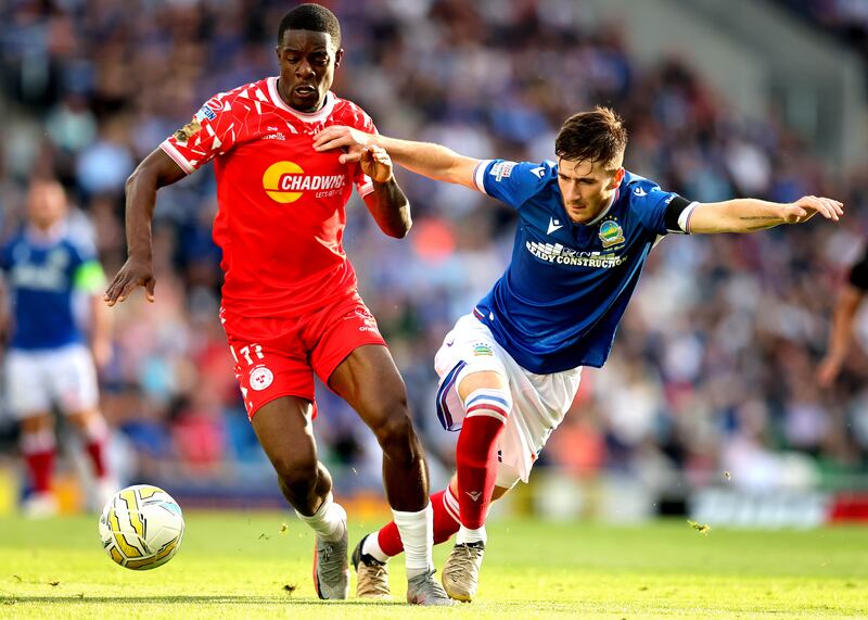 Shelbourne's Mipo Odubeko in action against Linfield’s Josh Archer. Photograph: Ryan Byrne/Inpho
