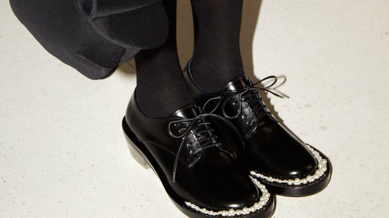 Black brogues with pearl trim, €249, black socks €29.99, neoprene bag, €59.99.