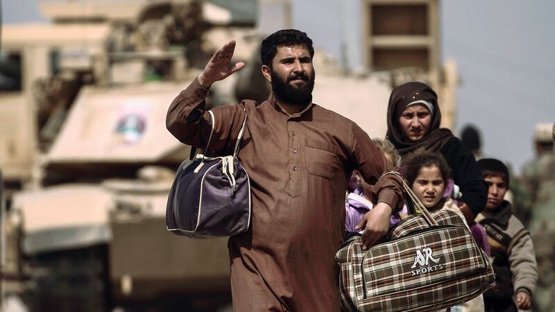 Displaced Iraqis flee their homes in western Mosul as Iraqi forces battle with Islamic State militants. Photograph: Zohra Bensemra/Reuters
