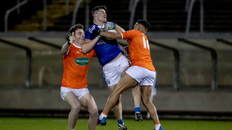 Cavan’s James Smith is challenged by Jarlath Óg Burns and Jemar Hall of Armagh during the Bank of Ireland Dr McKenna Cup match at Kingspan Breffni Park. Photograph: Morgan Treacy/Inpho