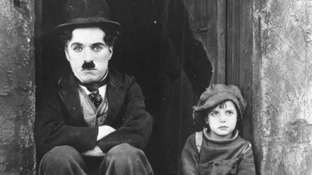 Charlie Chaplin and Jackie Coogan in The Kid: Chaplin was thought to be earning £130,000 a year in 1916. Photograph: AP Photo/File