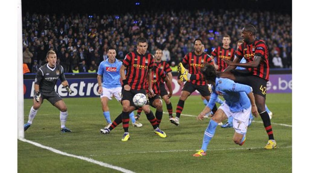 Uruguay international Edinson Cavani heads home Napoli’s first goal during the Champions League Group A clash at the San Paolo stadium. – (Photograph: Reuters).