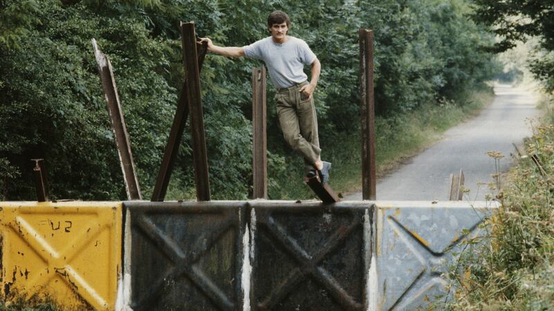 Former world champion boxer Barry McGuigan, from Clones, posing astride the Border between the Republic of Ireland and Northern Ireland in 1984. Photograph: Michael Brennan/Getty Images