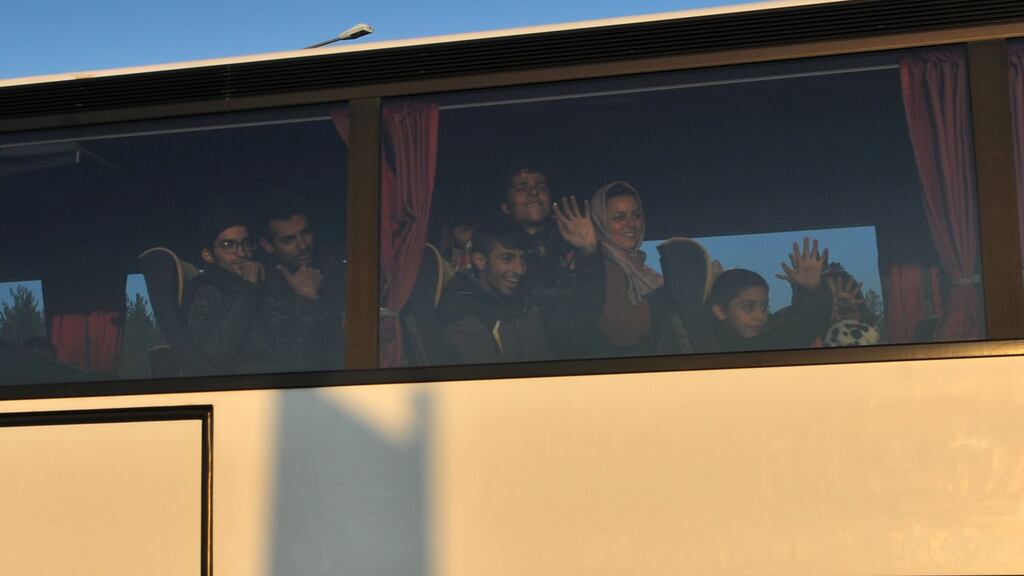 Migrants and refugees on bus bound for Athens after they were refused permission to cross the Greek-Macedonian border near Idomeni. Photograph: Sakis Mitrolidis/AFP/Getty Images.