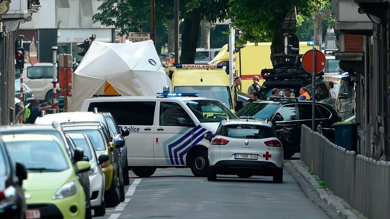 Police and ambulance are seen at the site where an armed man shot and killed police officers in the eastern Belgian city of Liege. Photograph: AFP/Getty Images