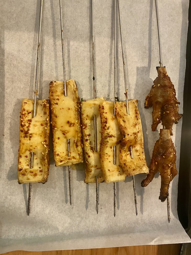 Tofu and chicken feet skewers