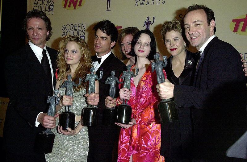 The cast of the film American Beauty: Chris Cooper, Mena Suvari, Peter Gallagher, Allison Janney, Thora Birch, Annette Bening and Kevin Spacey hold awards they won during the 6th Annual Screen Actor's Guild Awards in 2000. Photograph: Lucy Nicholson