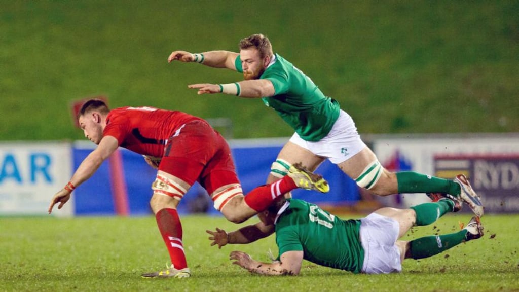 Ireland number eight Lorcan Dow and centre Sam Arnold move in to tackle Wales’ Harrison Keddie during the Under-20 Six Nations match at Parc Eirias in Colwyn Bay. Photograph: Morgan Treacy/Inpho