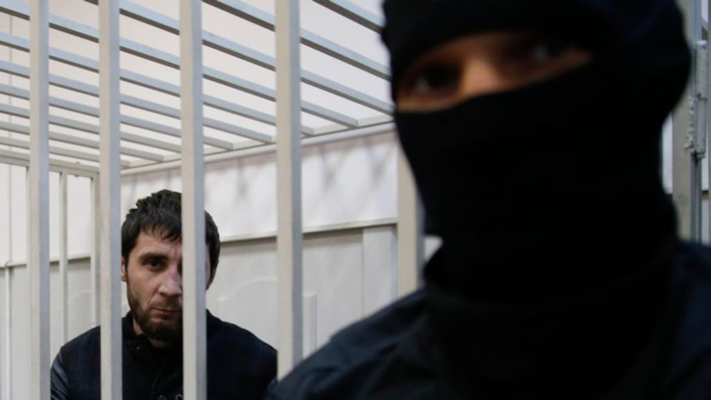 Zaur Dadayev, charged with involvement in the murder of Russian opposition figure Boris Nemtsov, looks out from a cage inside a court building in Moscow on Sunday. Photograph: Tatyana Makeyeva/Reuters