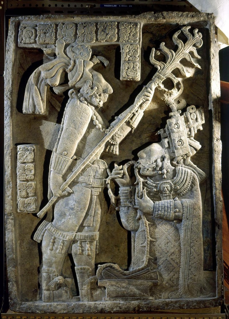 Lord Shield Jaguar stands with a flaming torch. His wife Lady Xoc is performing a blood sacrifice by drawing a thorn rope through her tongue, Mexico, Maya. (c AD 725). Photograph: Werner Forman/Universal Images Group/Getty Images