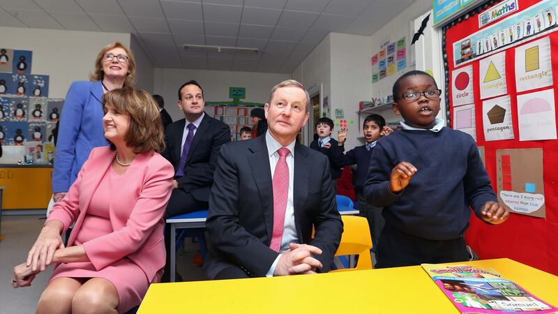 Taoiseach Enda Kenny, Tánaiste Joan Burton, Minister for Education and Skills Jan O’Sullivan and Minister for Health Leo Varadkar with Samuel Ogunbe (6) at Scoil Bhríde, Blanchardstown. Photograph: Colin Keegan/Collins Dublin