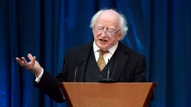 President Michael D Higgins signs two Bills into law