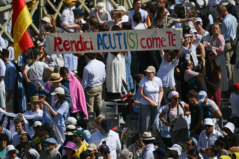 A banner reads with a play on words on the name of Acutis: 'Make us as sharp as you are'. Photograph: Filippo Monteforte/ AFP via Getty Images