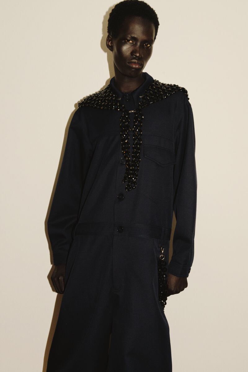 Navy wool twill boilersuit €1265, jet crystal beaded scarf €1030, jet crystal double twisted wallet chain €340